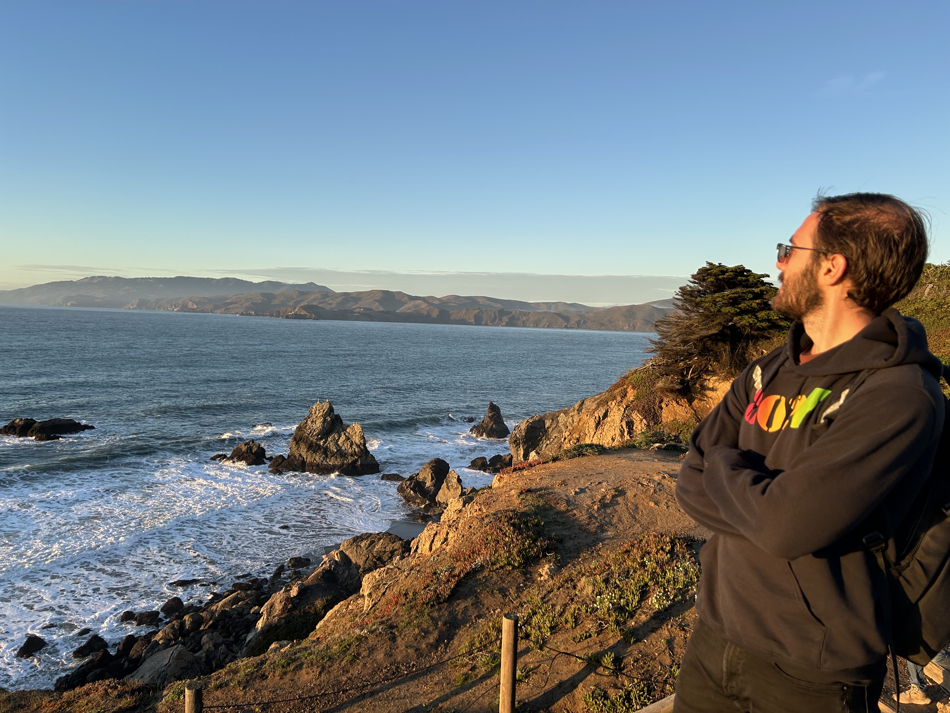 Adam Petrucci gazing over the Pacific Ocean at Land's End in California.